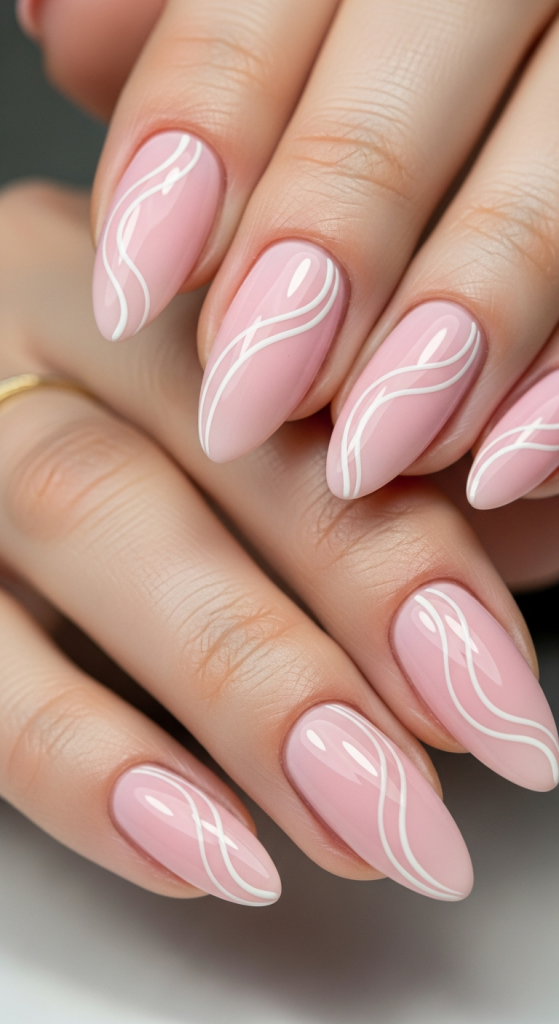 Pink Almond Nails With Minimal White Swirls